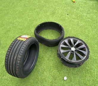 Two tyres on grass ready for swap – Swap Tyres Bathgate | Mobile Tyre Replacement Service